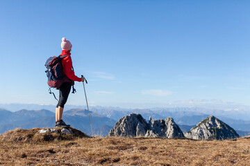 Backpacker Hiking Woman Adventurer Looking at View in High Mountains