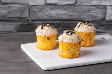 Three creamy holiday Easter cupcakes with white icing