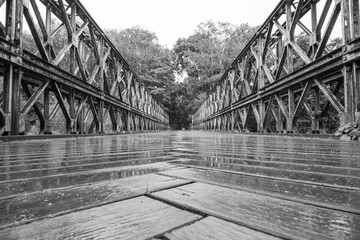 Old truss bridge over Sazava River. Black and white image.