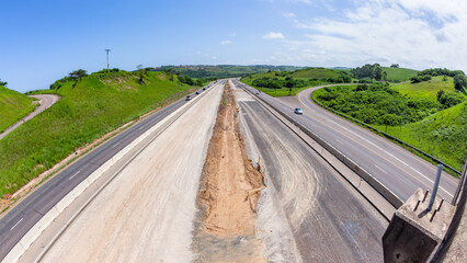 Driving Road Highway New Construction Expansion Of Vehicle Lanes Overhead Landscape Photograph. - 697676693