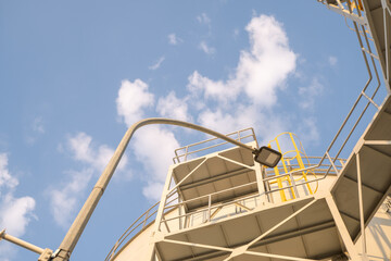 plate form on the service water tank with blue sky. The photo is suitable to use for industry...