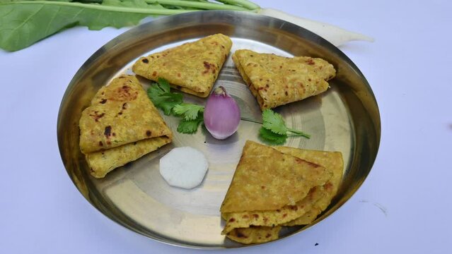Mooli paratha or Radish flatbread. Healthy Indian Mooli paratha. Daikon flatbread. It is a popular food of india. It can be eaten for breakfast, lunch and dinner. Indian food. 