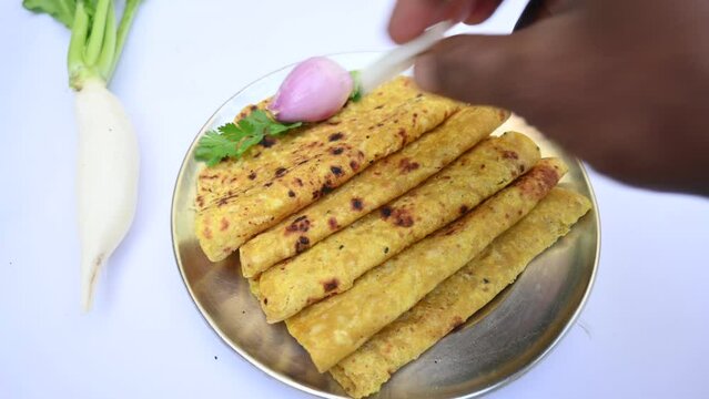 Mooli paratha or Radish flatbread. Healthy Indian Mooli paratha. Daikon flatbread. It is a popular food of india. It can be eaten for breakfast, lunch and dinner. Indian food. 
