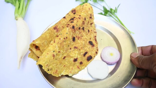 Mooli paratha or Radish flatbread. Healthy Indian Mooli paratha. Daikon flatbread. It is a popular food of india. It can be eaten for breakfast, lunch and dinner. Indian food. 
