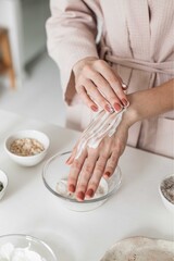 Woman Applying Moisturizing Hand Cream in a Home Beauty Routine
