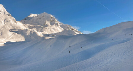 Fototapeta na wymiar view on beautiful snowy montain in ski resort in Tarentaise France