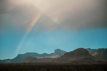 Rainbow Arches Over Chisos Mountains In Big Bend
