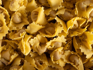 Tortellini di Valeggio Sul Mincio uncooked fresh pasta background