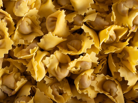 Tortellini di Valeggio Sul Mincio uncooked fresh pasta background