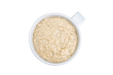 Cup with cooked oats isolated on white background