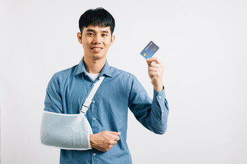A man with a damaged arm shows confidence, donning a support splint, and settling medical bills via...