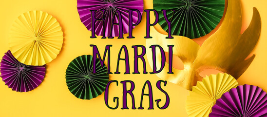 Mardi Gras.Colorful group of Mardi Gras or venetian mask on yellow,Mardi gras carnival decoration beads yellow background. - obrazy, fototapety, plakaty