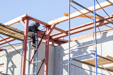 Welder works at height, welder's work