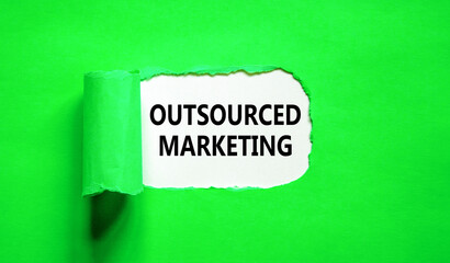 Outsourced marketing symbol. Concept words Outsourced marketing on beautiful white paper. Beautiful...