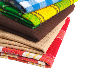 The stack of colorful kitchen towels. Textile dish wipe clothes isolated on white with copy space area for design elements. - 697735406