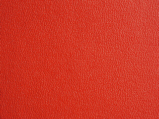 Leather surface of the material with a red color on bags and clothes