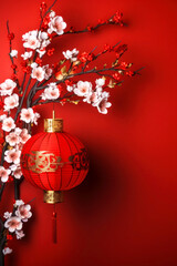 Traditional Chinese lantern and flowers on a red background and copy space for text, vertical background for the Chinese New Year