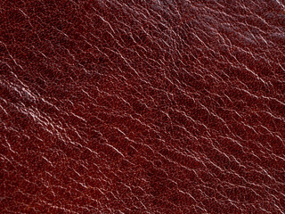 The material is leather, it is bright red, buffalo leather, selective focus