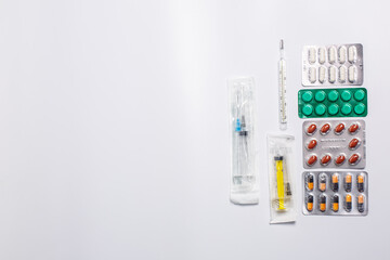 Many different blisters with tablets, medicine, treatment tablets, syringes
