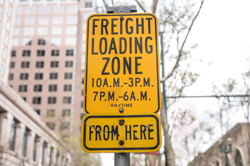 Freight loading zone from here yellow sign
