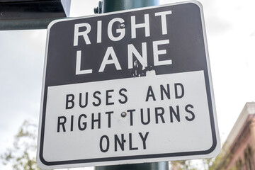 Right lane buses and right turns only sign on the street