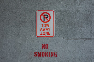 Tow away zone no parking no smoking sign

