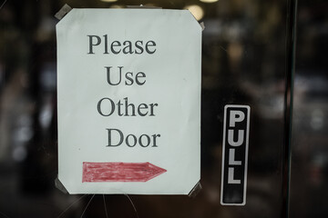 Please use the other door sign and pull sign