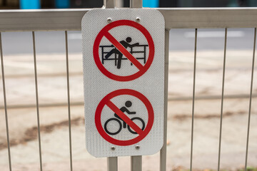 No Sitting Symbol Sign no bicycle sign on the fence