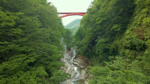 Cinematic aerial shot of steam vents at Oyasukyo Gorge in Akita prefecture in Japan