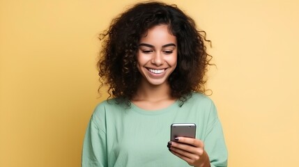 Girl with dark curly hair and brown skin holds a cell phone