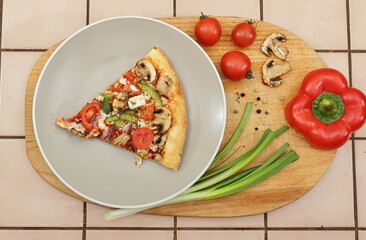 pizza with tomatoes and basil
