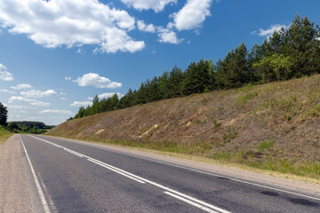 Naklejka premium small hills through which the highway passes