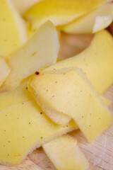 yellow ripe apple with cinnamon on the table