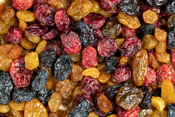 dried cranberries with yellow and black raisins mixed together