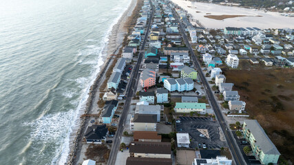 Aerial view of Carolina Beach, NC, with residential homes along the shoreline.