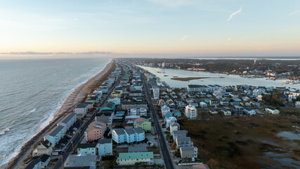 Aerial view of Carolina Beach, NC, with residential homes along the shoreline.