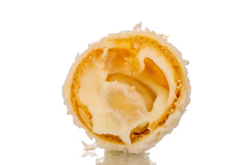 One half candy with nut and coconut flakes, macro, isolated on white background.