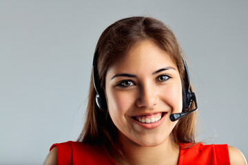 Cheerful, approachable woman wears communication headset
