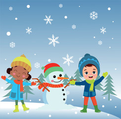 Fototapeta premium Children making snowmen playing outdoors in winter
