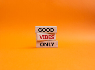 Good Vibes only symbol. Concept words Good Vibes only on wooden blocks. Beautiful yellow background. Business and Good Vibes only concept. Copy space.