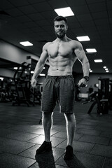 Fototapeta na wymiar Muscular shirtless man training hard. Sportive lifestyle motivation concept.