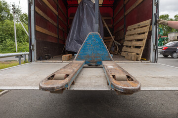 A hand truck for pallets in the back of a truck. cargo transportation