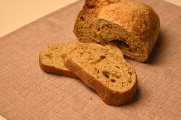 sliced ​​white bread in pieces on a gray background