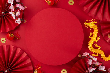 Welcome Chinese New Year with breathtaking decorations. Top view photo of gold dragon, paper fans,...
