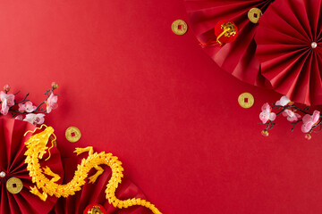 Celebrate Chinese New Year 2024 in an awe-inspiring style. Top view flat lay of gold dragon, red...