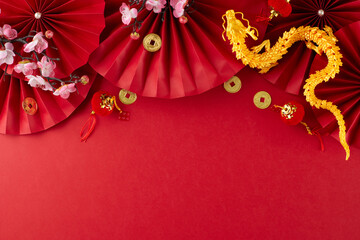 Embracing the spirit of Lunar New Year 2024. Top view composition of gold dragon, featuring fans,...