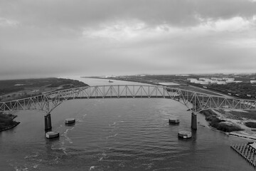Aerial view of the Sabine Lake Causeway Bridge at Port Arthur Texas on an overcast day.