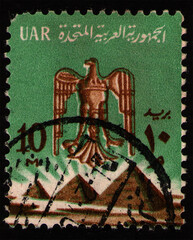 EGYPT - CIRCA 1966: stamp 10 milliemes printed by Egypt, shows Saladin Eagle, Pyramids in Giza,...