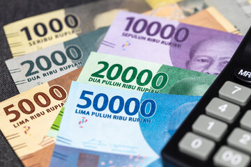 Indonesian rupiah, Indonesian money and calculator, concept, financial settlements - obrazy, fototapety, plakaty