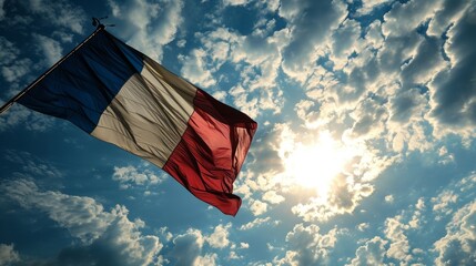 Flag of France. French tricolor against a blue sky. - obrazy, fototapety, plakaty